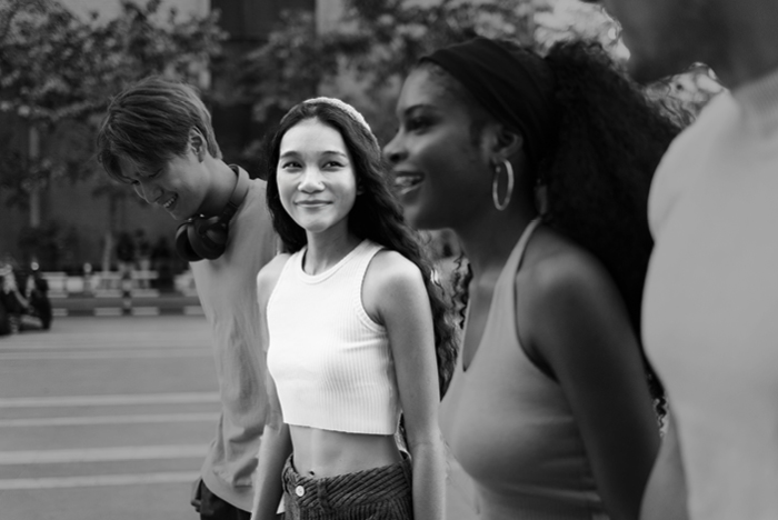 Limited - Young adults crossing the road